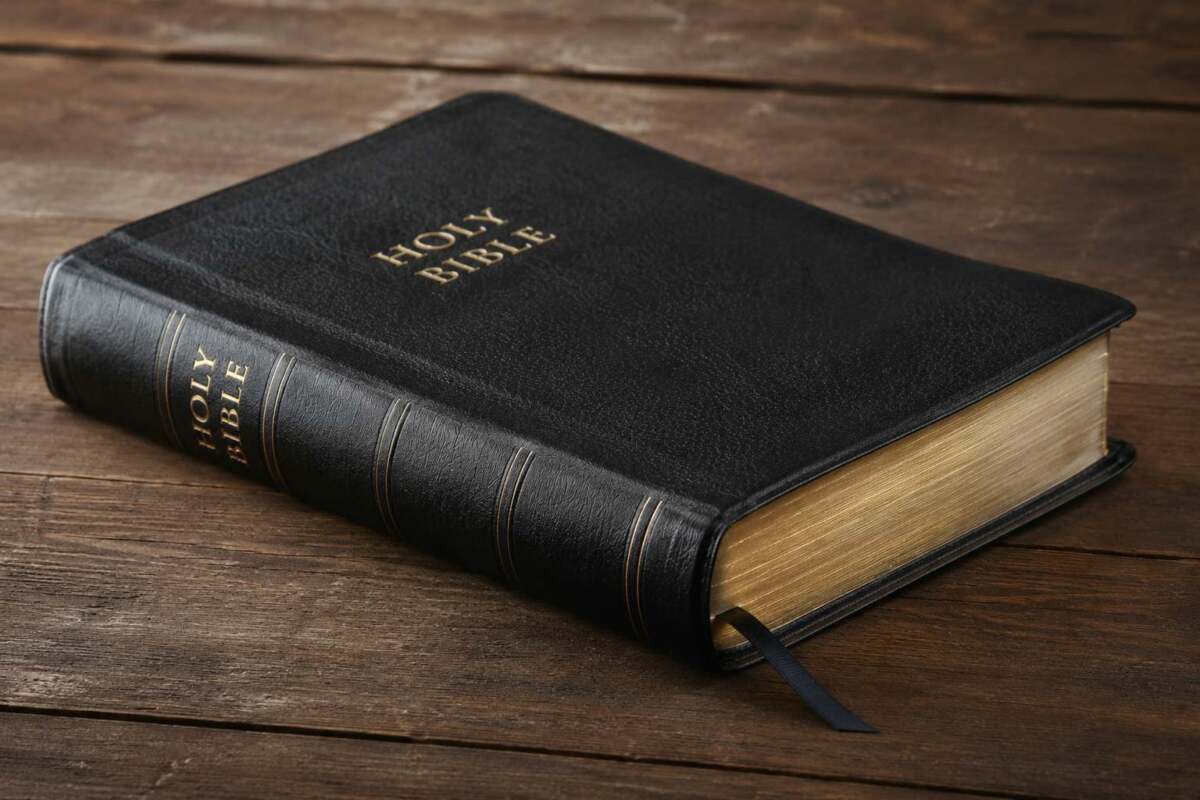 Leather bound Bible on wood table